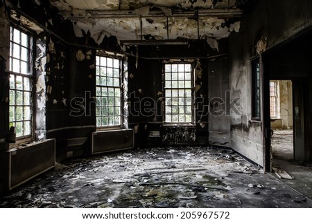 inside view of a deserted run down building after a fire