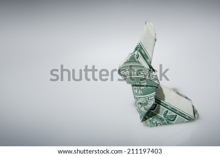 Still life image of a origami rabbit make from one dollar note