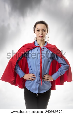 business woman wearing a super hero cape