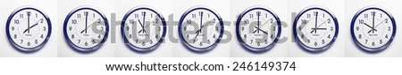 clock on the wall of time zones for trading around the world set at 3PM london GMT time. image is black and white with a blue tint