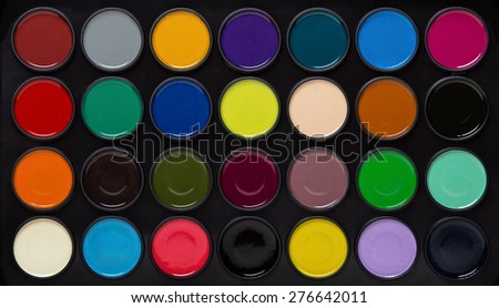 kids play paint set of different colors shot close up