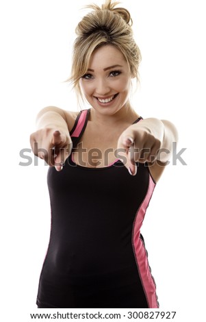 young  attractive fitness woman pointing at you