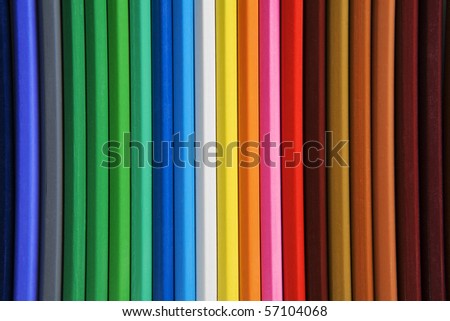birds eye view of pencil all together in a straight line. rainbow of colours