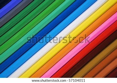 birds eye view of pencil all together in a straight line. rainbow of colours