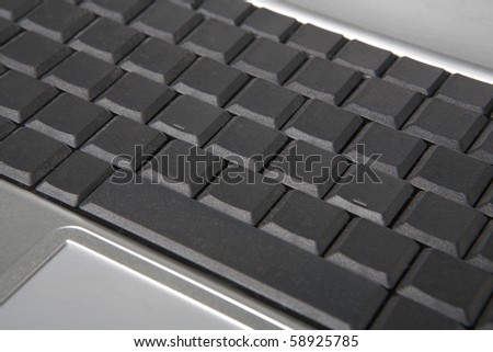 close up detail image of a laptop keyboard with all the letters, symbol and character missing