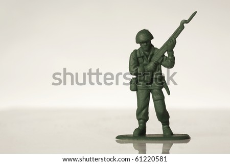 green toy soldiers on white back ground