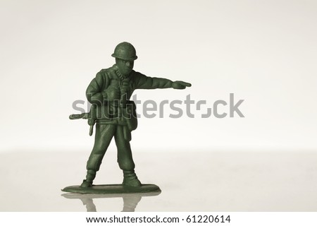 green toy soldiers on white back ground