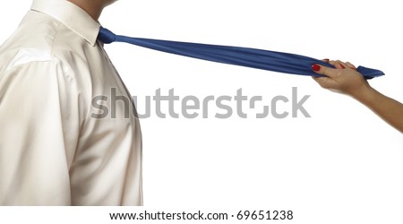 close up of womans hands pulling on a mans tie