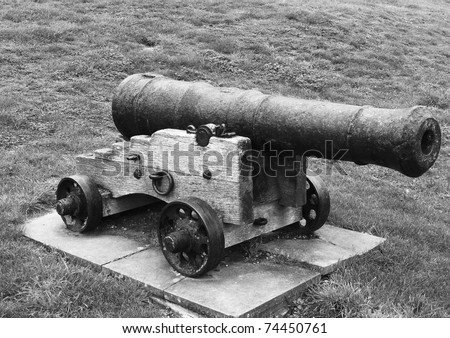 old war cannon on grass