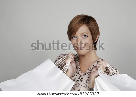 woman looking very happy with herself with all the shopping she done