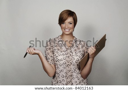 woman holding a clip board shot in the studio