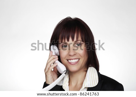 woman on a land line phone talking to someone