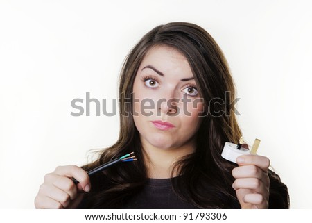 young woman not sure how to wire in a plug
