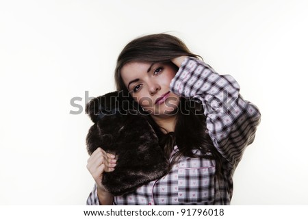 woman wearing pajamas and holding a nice  hot water bottle getting ready to go to bed