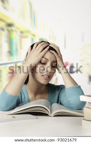 student looking at all her work and finding hard to do and understand