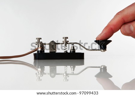 morse code key on a white background with someone sending a message