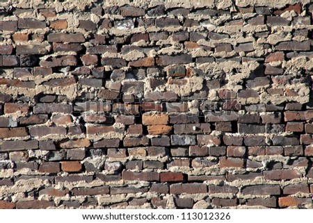Antique brick and mortar wall closeup