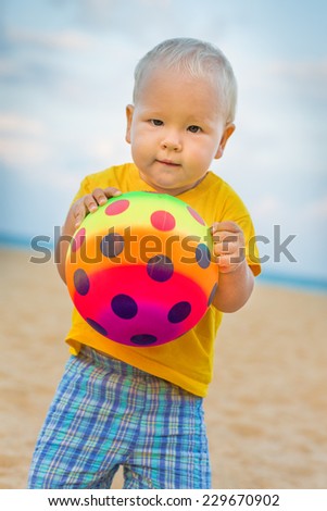 Baby playing with toy ball