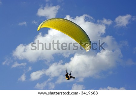 paraglider on the blue sky