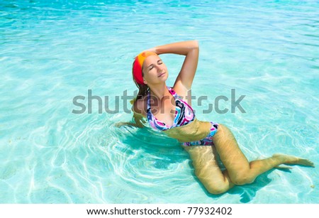 Beautiful bikini woman relaxing in the sea