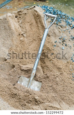 shovel and sand for mix cement in construction place
