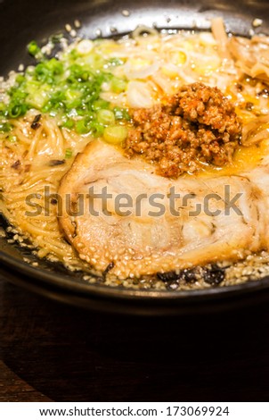 ramen japanese food style roasted pork and spicy ground pork sauce with onion sliced noodle in soup sesame on topping