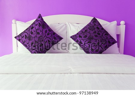 Purple bedroom in a modern house - home interiors.