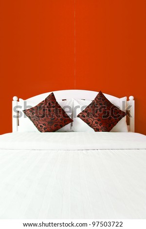 Red bedroom in a modern house - home interiors.