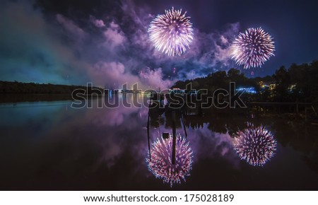 Fireworks at night over water