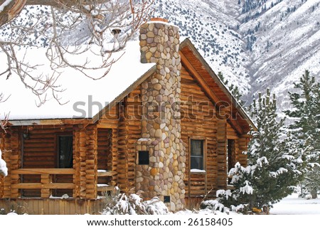Log cabin in the mountains during the winter.