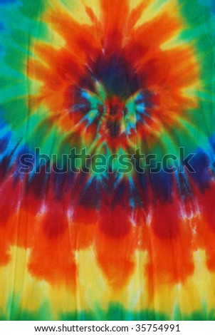 Bright colored tie dye pattern on fabric.