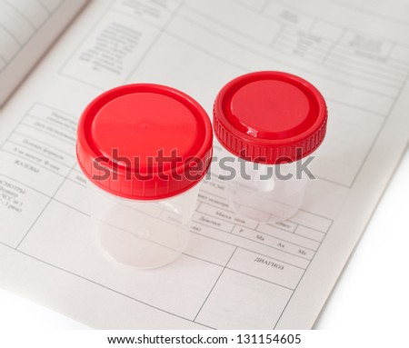 Two sterile medical containers on medical blank