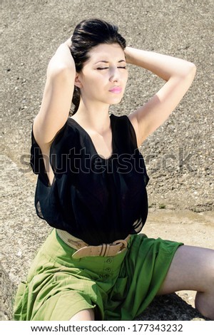 Beautifu brunette girl in casual outfit on a warm sunny day