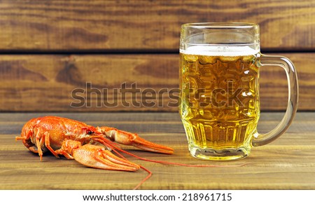 Tasty boiled crayfish and beer on a table