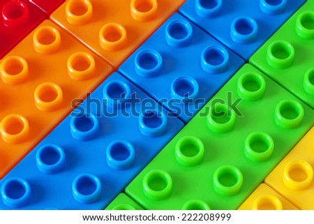 Toy background made of colored plastic bricks
