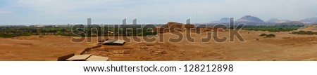 Panoramic photo of Huaca del Sol and archaeological excavations. This photo is made attaching together various photos
