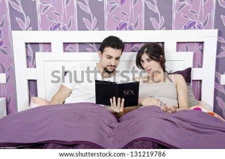 This book will help us. (couple in a bed.)