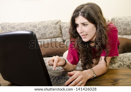 Girl with portable PC surfing Internet