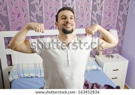 Man waking up in a bedroom with energy.