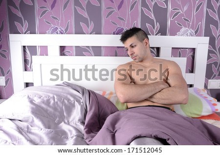 Young man lonely at home bedroom with crossed arms