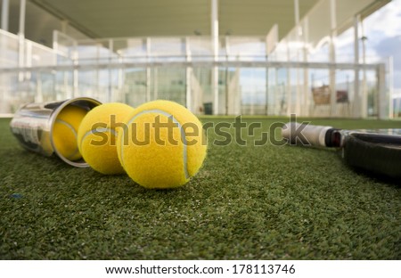 Paddle tennis or tennis balls, tube and racket