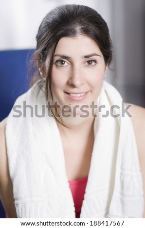 Closeup portrait of beauty girl with gym towel
