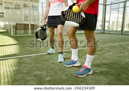 Paddle tennis body parts of anonymous team couple