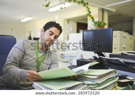 real office clerk with ambient light ooing some files