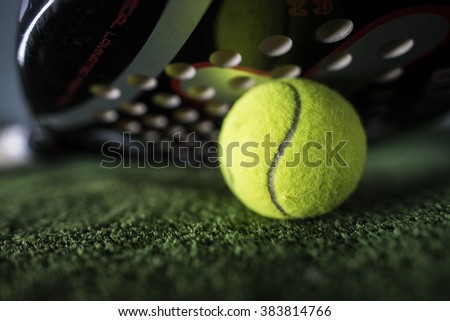 Paddle tennis macro wide angle image of racket and ball