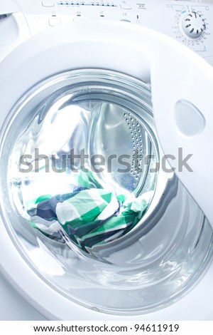 clothes washer with green fabric