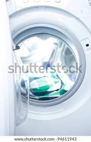 clothes washer with green fabric