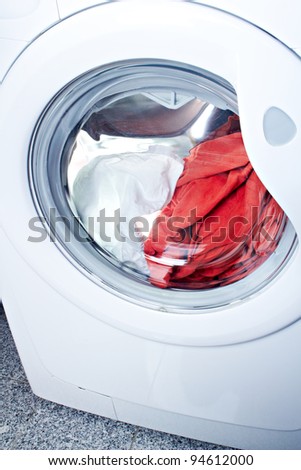 clothes washer with red and white fabric