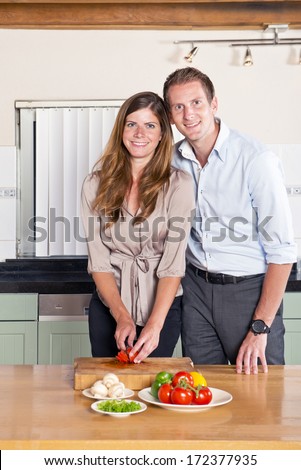 Work - Life Balance Concept: Couple cooking dinner together after work
