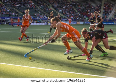 THE HAGUE, NETHERLANDS - JUNE 2: Dutch Jonker is lifting her stick to control the ball, Belgium player de Groof is trying to take over the ball during the Hockey World Cup 2014 NED beats BEL 4-0